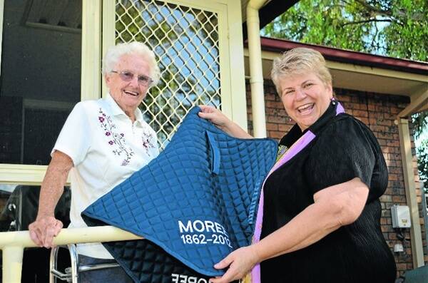 Moree Plains Shire Mayor Katrina Humphries receives a saddlecloth kindly donated by Jill Burling.