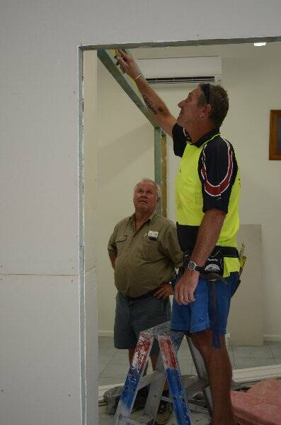 Gwydir Constructions director Ron Gunther and employee Stephen Browne building their new office.