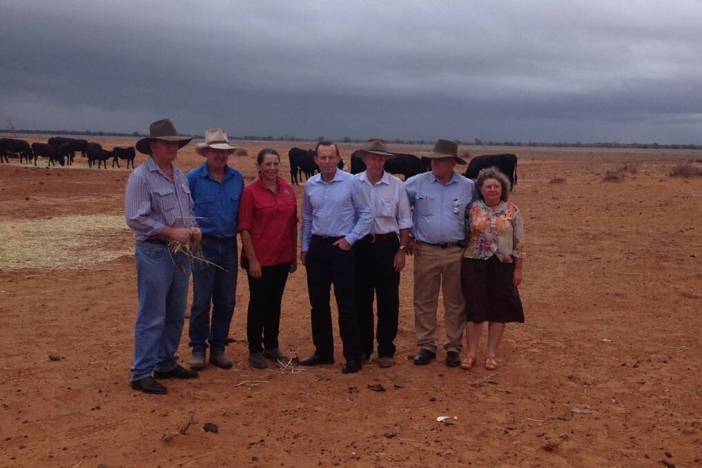 Minister for Agriculture, Barnaby Joyce, graziers Phillip and Di Ridge, Prime Minister Tony Abbott, Parkes MP Mark Coulton, Bourke Shire Council mayor Andrew Lewis and wife Lorraine.