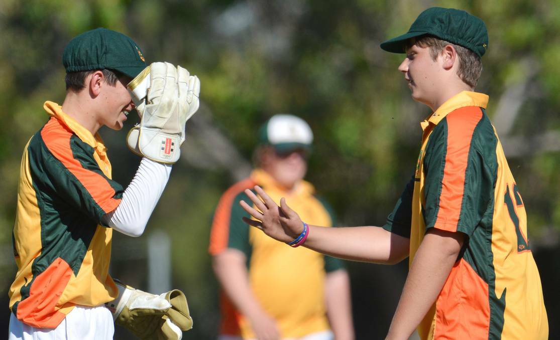 Farrer 2’s Lachlan Fauchon (left) and Lachlan Cook celebrate a wicket against Oxley High on Monday. Fauchon then hit an unbeaten century and Cook a half-century in Farrer’s unsuccessful run chase. Pic: NORTHERN DAILY LEADER