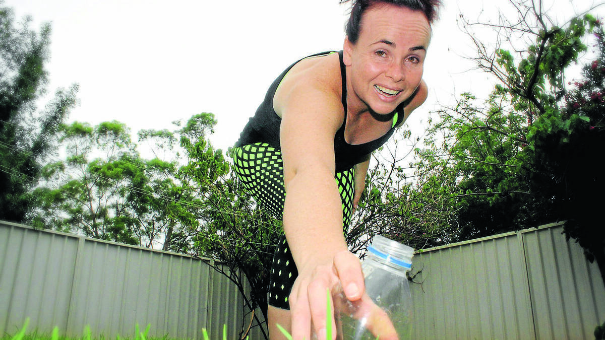 : Rachel Bulkeley picks up a plastic bottle before heading out for a run. Pic: NAMOI VALLEY INDEPENDENT