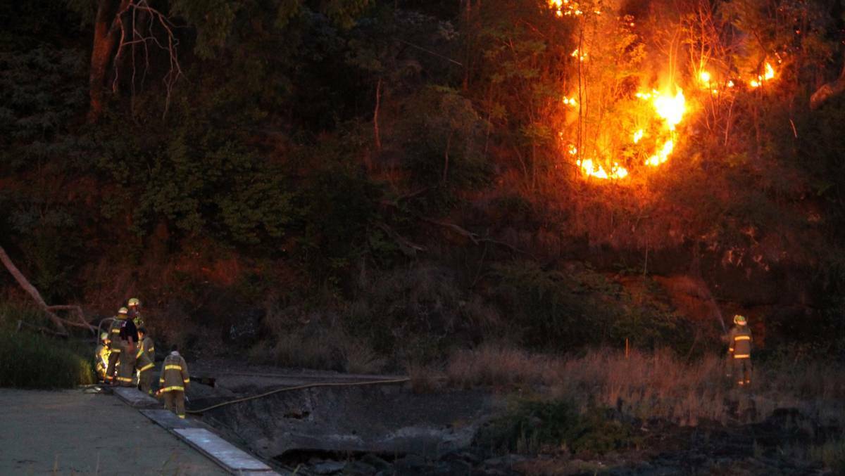 Firemen used water from the weir to fight a fire on the riverbank near Inverell's CBD. Pic: INVERELL TIMES