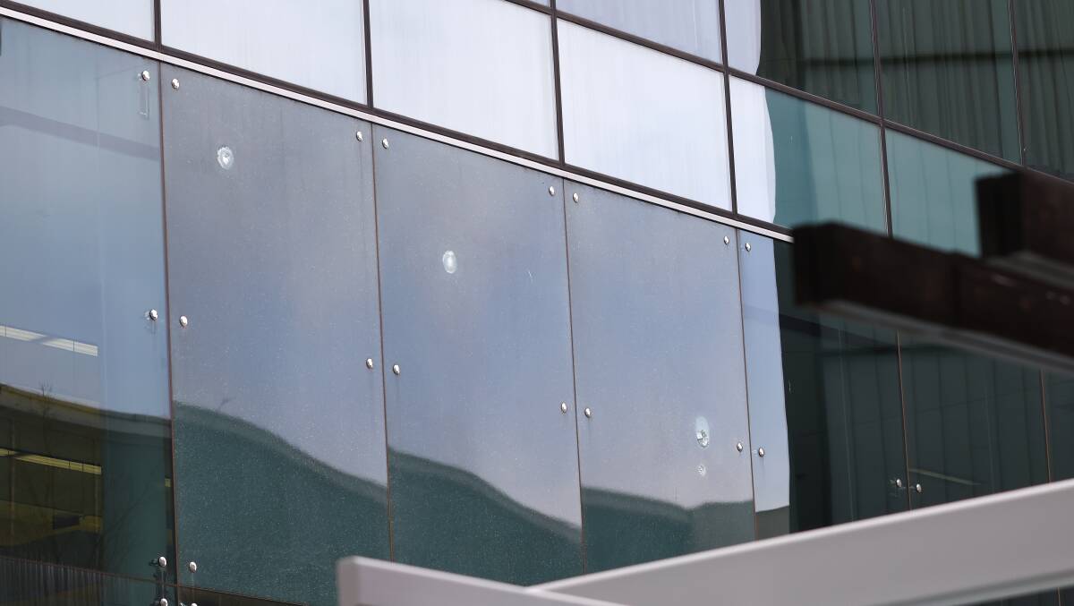 Bullet holes in Canberra Airport glass. Picture: Keegan Carroll