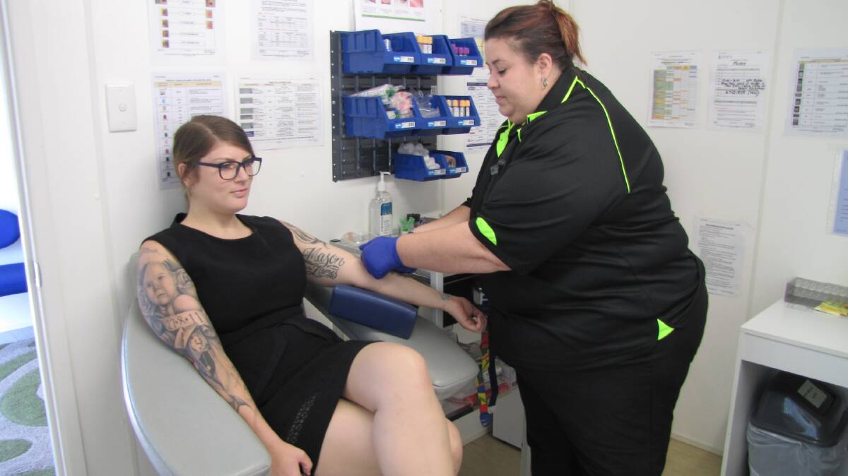 BLOOD COLLECTION: Destiny Powell is getting her blood collected from local phlebotomist Bianca Mills.