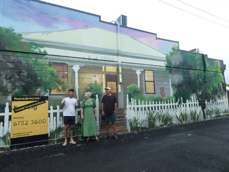 Principal of Raine & Horne Moree, Kelly Atkins, was a successful recipient in the 2023 Small Business Funding Pilot Program, colouring up her business wall with a mural. Picture supplied.