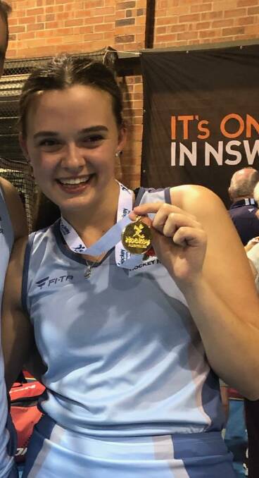 Lara Watts with her gold medal after the Australian indoor hockey championships at Wollongong.