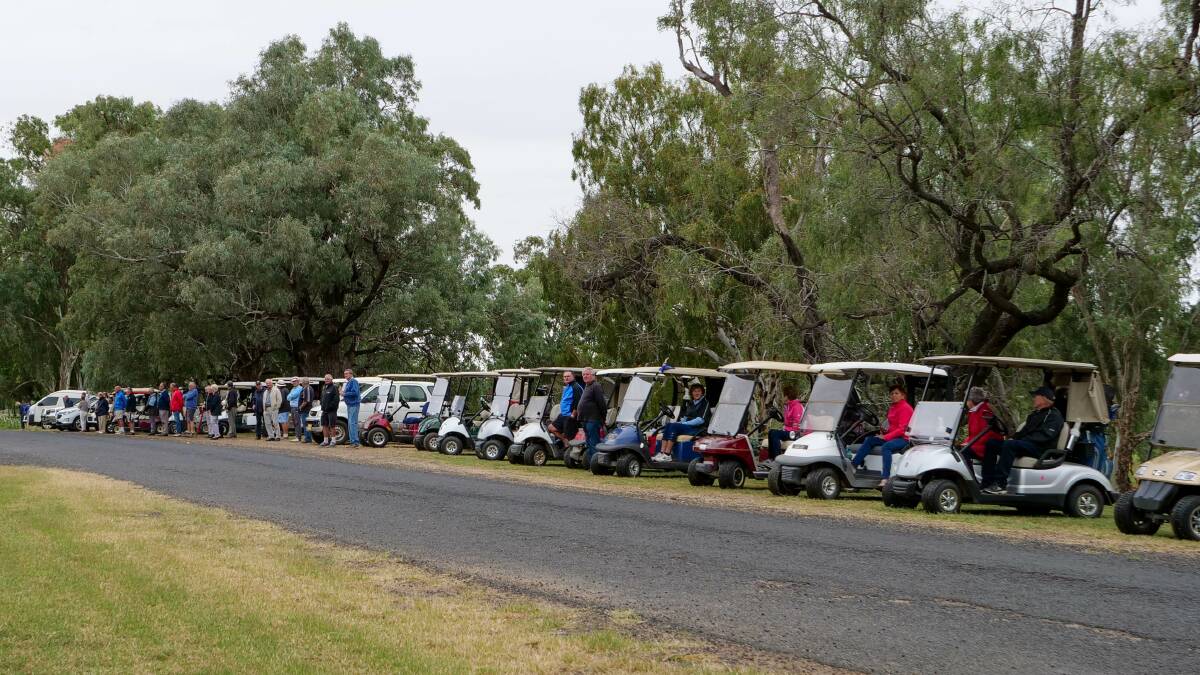 FITTING TRIBUTE: Members of the Moree Golf Club and Moree Motor Enthusiast Club formed a guard of honour along the road between the golf course and cemetery for John's funeral. Photo: Merri-May Gill