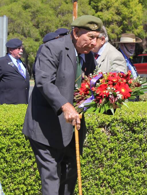 Lloyd Fletcher lays a wreath on behalf of the National Servicemen's Association.