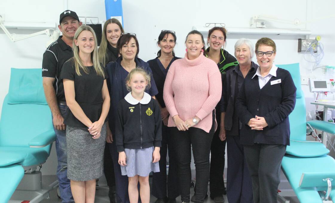 GENEROUS DONATION: Moree Bulls president Paul King with Ladies Day committee members and Moree Oncology Unit staff (l-r) Sarah Grant, Nicole Youngberry, Karen Gulson, Lucy Grant, Jenny Bingham, Marguerite McCormick, Sophie Evans, Sandra Hollands and acute health service manager Bronwyn Cosh.