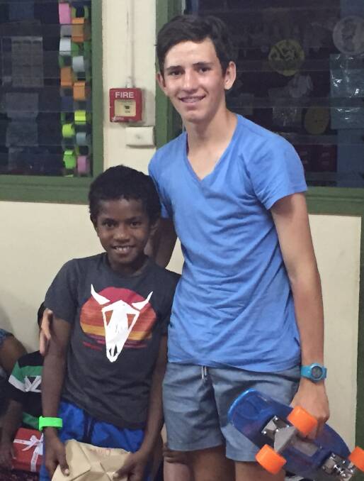 MAKING A DIFFERENCE: Oliver Cook got to know a little buddy from St Christopher’s Orphanage Fiji.