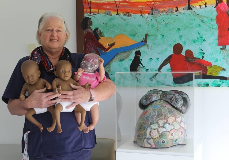 WOMEN'S HEALTH ADVOCATE: AMIHS midwife Debbie Key pictured next to one of the belly castings in the maternity ward, with three of the dolls she uses during antenatal classes to demonstrate the effects drugs, alcohol and shaking has on a baby.