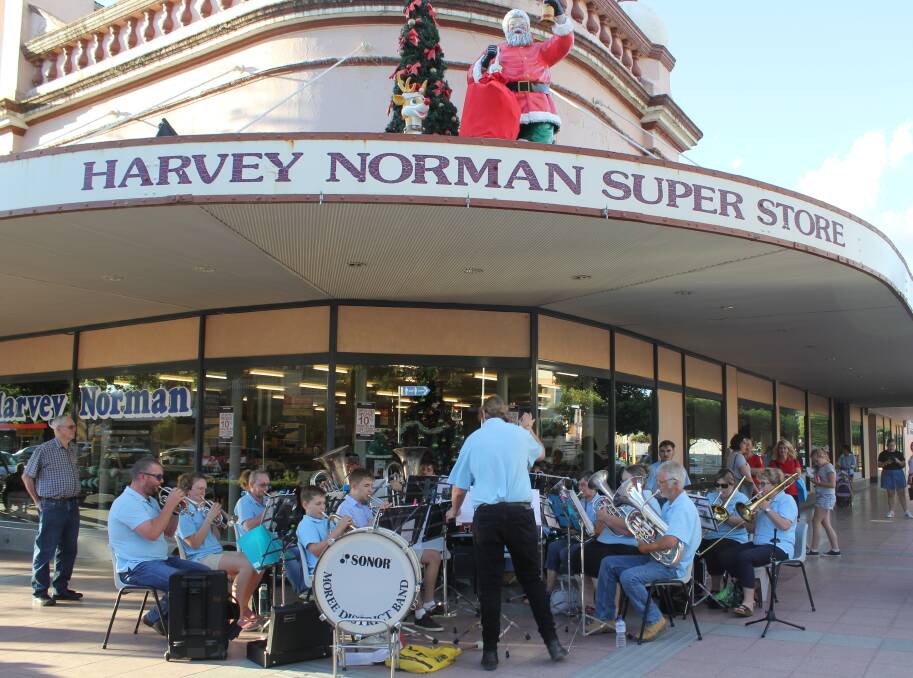 CHRISTMAS SPIRIT: Moree and District Band performed Christmas carols at the late night shopping event last week.