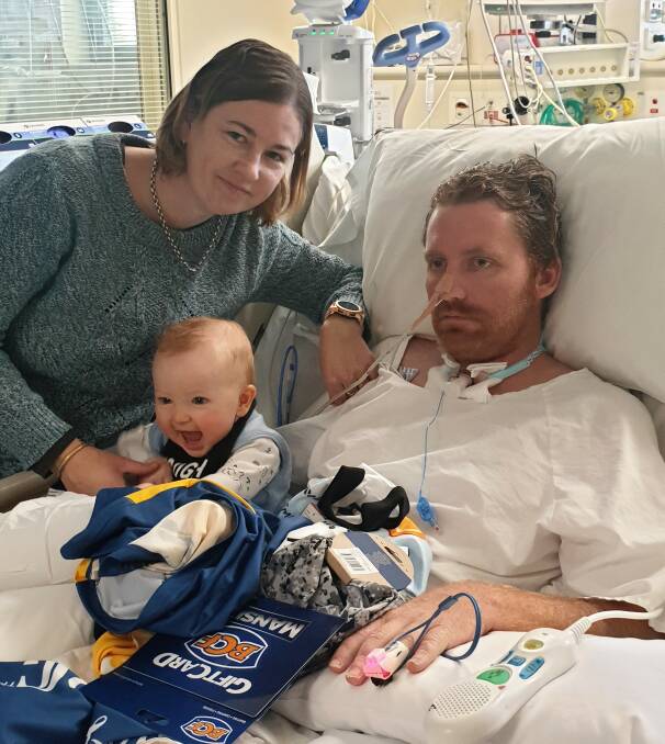 Red celebrated his first Father's Day in hospital, with wife Elle-May and eight-month-old son Ollie by his side.