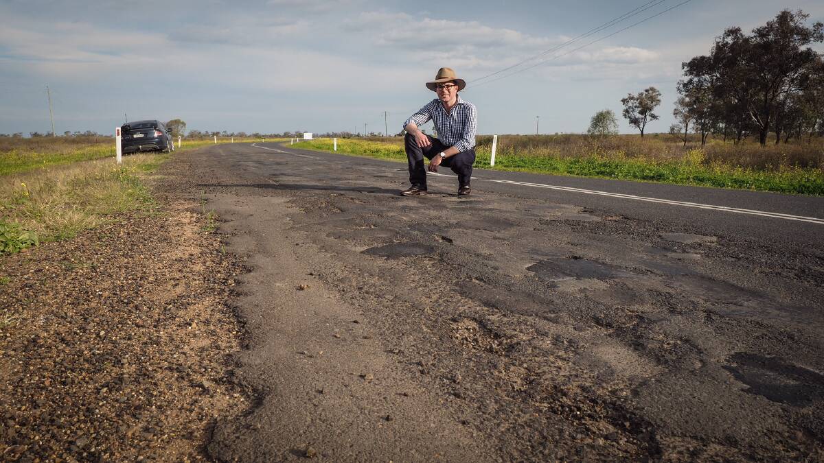 Northern Tablelands MP Adam Marshall inspects one of the rough patches of the Carnarvon Highway which will soon be upgraded.