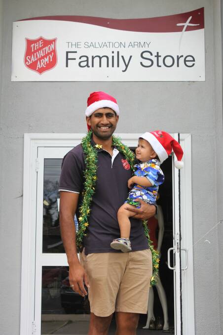 Moree Salvation Army program manager Jason Poutawa and his son Israel encourage Moree residents to spread hope this Christmas.