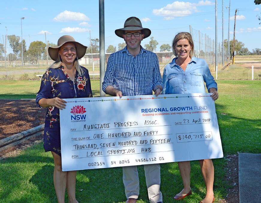 Mungindi Progress Association secretary Brooke Luhrs, Northern Tablelands MP Adam Marshall and Association president Anna Harrison happily receivw the cheque for funding to upgrade sports facilities in Mungindi.