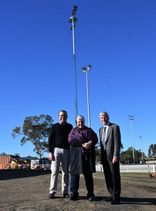 Northern Tablelands MP Adam Marshall, Moree mayor Katrina Humphries and MPSC director of engineering Ian Dinham inspect the progress of the new LED lights (the tallest posts).