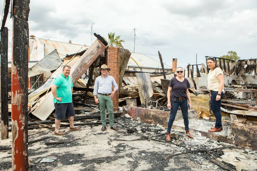 Mungindi SPAR Supermarket owner Jeff Sykes, Northern Tablelands MP Adam Marshall, PJs Country Wares proprietor Jane Harrison and Prue Sykes survey the fire damage recently. Photo: supplied