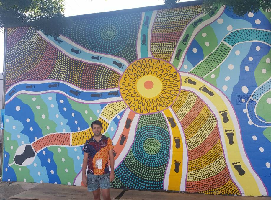 Green's mural 'Gariya', or Rainbow Serpent, has a focus on community and people coming together from all walks of life to enjoy and experience the art at the mural festival, under the protection of the Rainbow Serpent.