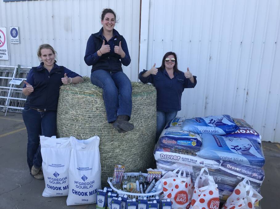 OVERWHELMED BY SUPPORT: McGregor Gourlay's Tegan George, Bree Pring and Maddison Richards with some of the goods that have been donated to the Moree Drought Muster.
