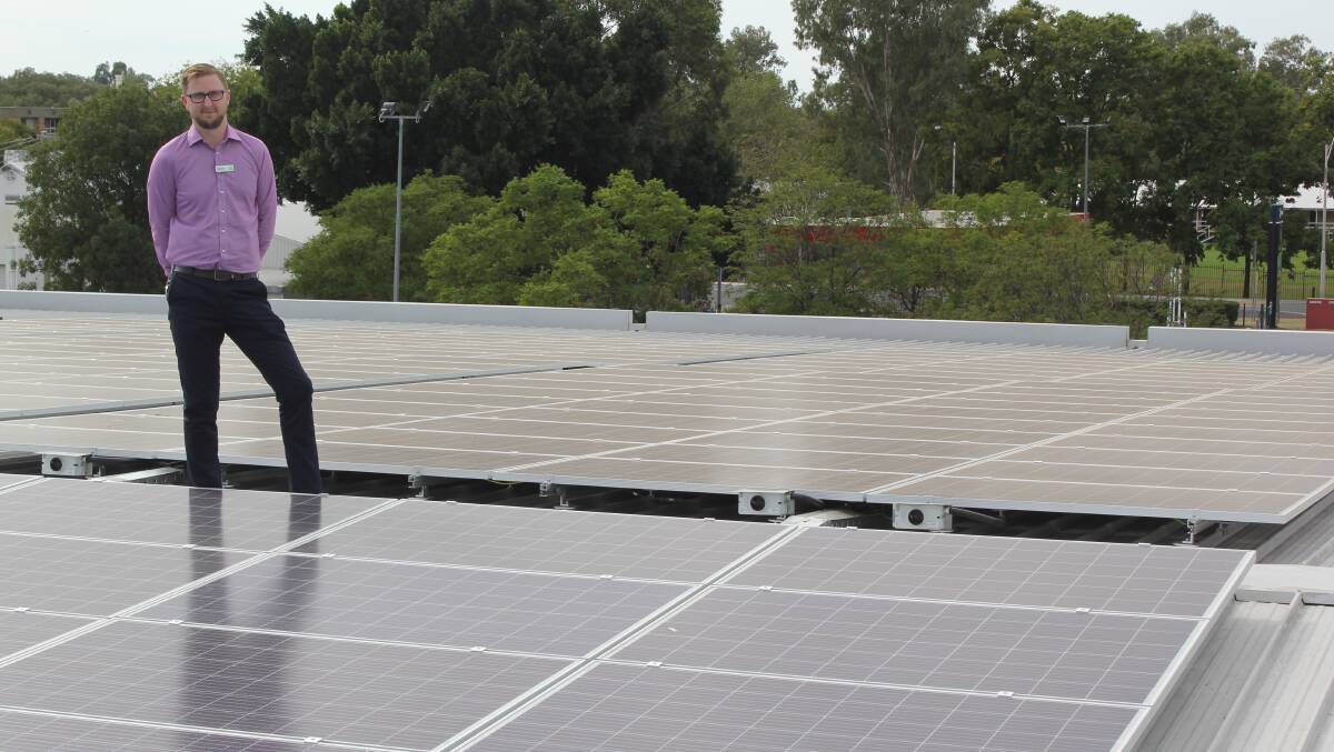 GREEN POWER: Woolworths Moree store manager Andrew Finch pictured with some of the 357 solar panels that were installed on the roof this month.