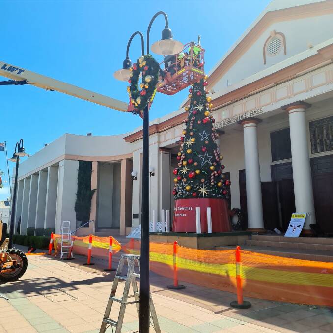 Moree's Christmas tree being decorated at Town Hall. Photo: supplied