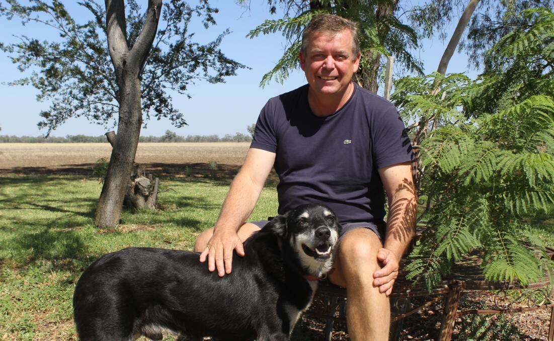 WATER SAVER: Moree irrigator Chris Lamey, pictured at his home in town with dog Tommy, believes it's everyone's responsibility to save water.