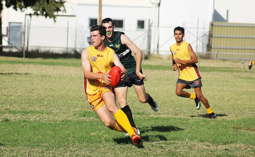 ON ATTACK: Jack Montgomery in action against New England Nomads on Saturday. Photo: Haley Caccianiga