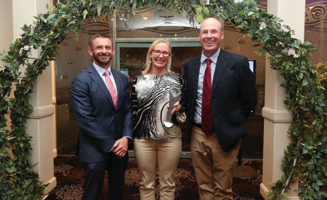 Bayer sales lead Mark Dawson with Bayer Cotton Grower of the Year winners Charm and Tom Arnott at last year's awards presentation. Photo: supplied