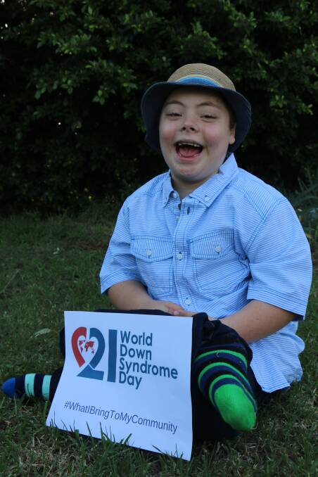 CELEBRATION: Seven-year-old Anthony Phillips rocks mismatched socks for World Down Syndrome Day today.