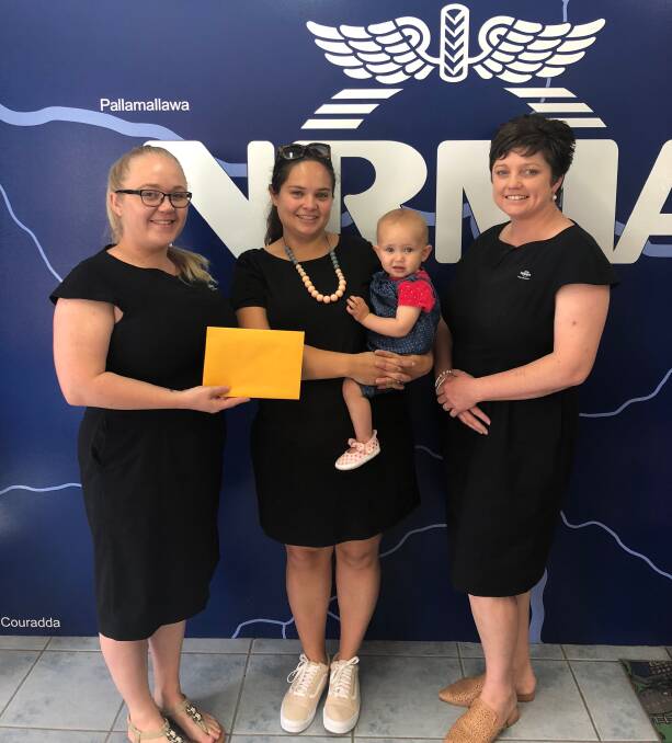 NRMA Moree's Fallyn Munro (left) and Sally Johnson (right) presented Zeena Tersoriero  and her daughter Frieda Murron Tersoriero with the $5,000 pre-paid visa card.