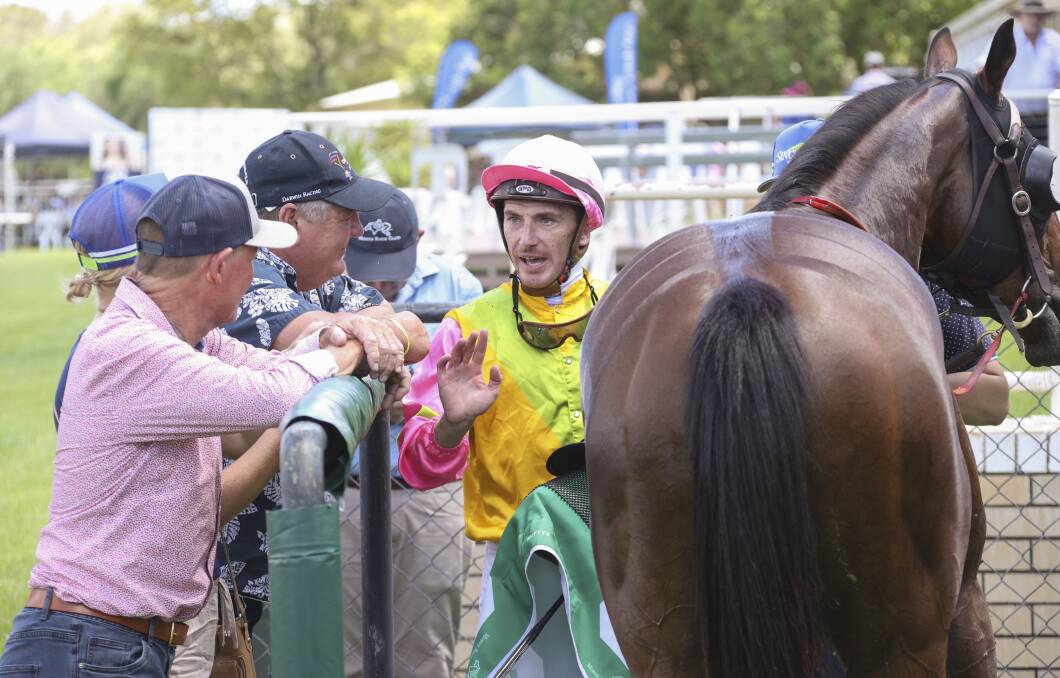 Suvero jockey Ben Looker chats to trainer Peter Sinclair after a great win in Moree on Saturday. Photo: Bradley Photos