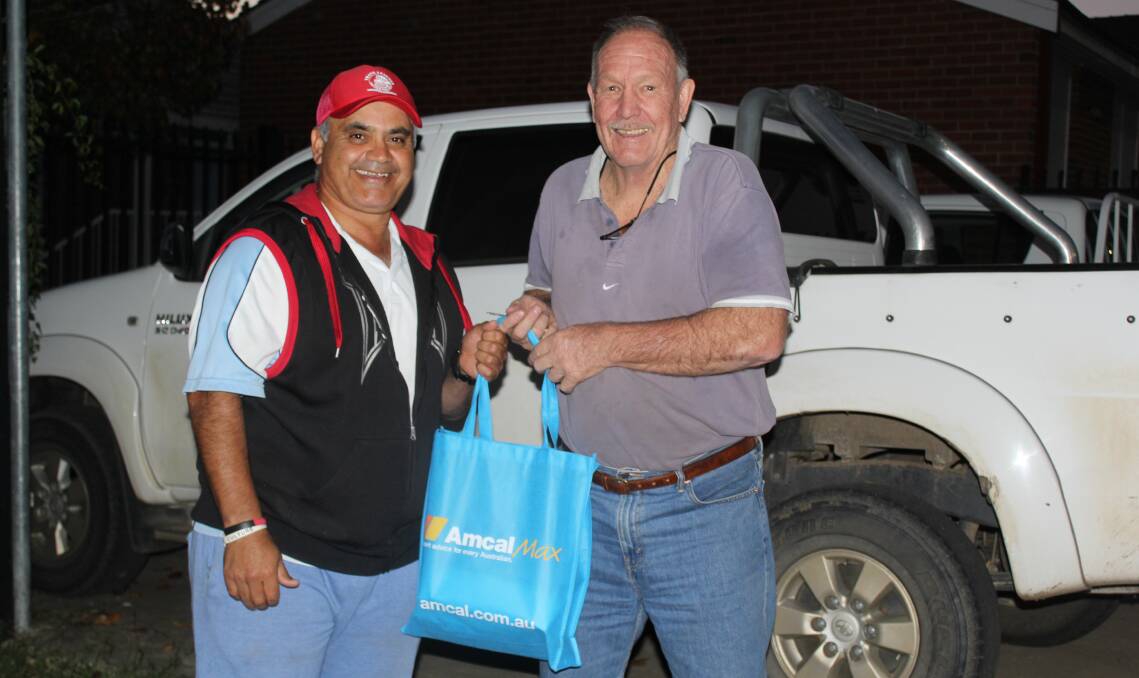 Moree Mobile Neighbourhood Watch members Chris Binge and Stephen Ritchie with the first aid kit which was donated by Amcal Chemist Moree.