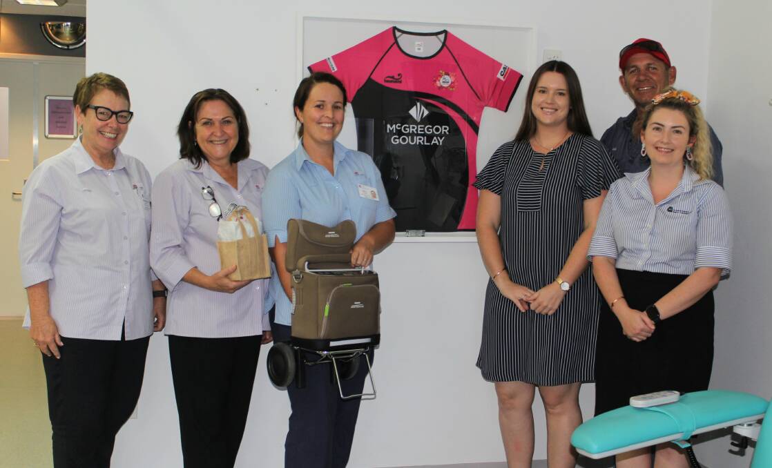 Moree Hospital acute health service manager Bronwyn Cosh, community health manager Anne Lemmon with one of the care packs, palliative care clinical nurse consultant Sally Laurie with the portable oxygen concentrator, pictured with Ladies Day committee members Nicole Youngberry and Jess Thompson and Bulls president Paul King.