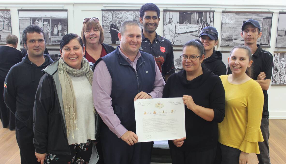 Moree Reconciliation Group members presented the original copy of Kevin Rudd's apology to MPSC's director of corporate services Mitchell Johnson and Dhiiyaan Centre's Raquel Clarke during last year's Reconciliation Week official opening.