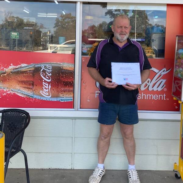 Greenbah Store owner Snow Miller with the July Essential Business Appreciation Award. Photo: supplied
