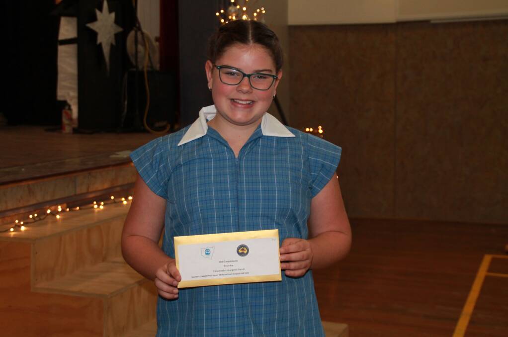 Ruby Boughton was all smiles when she received the ICPA Collarenebri-Mungindi branch award at her school presentation event in December. Photo: contributed