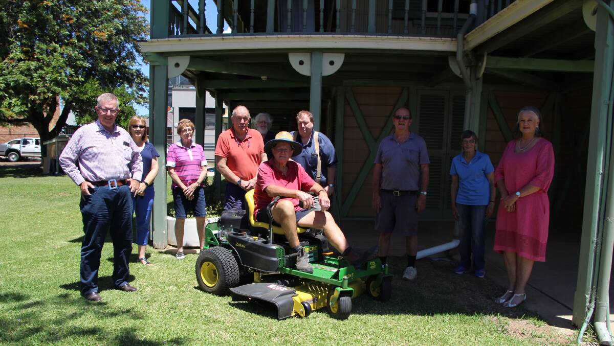 Federal Member for Parkes Mark Coulton with members of Moree and District Historical Society and their new lawn mower. Photo: supplied