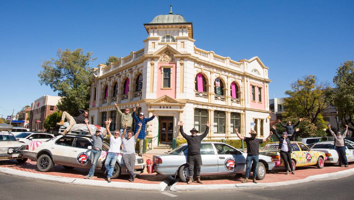 Some of the rally participants took the opportunity to pose in front of Bank Art Museum Moree during their pit-stop in Moree on Tuesday. Photo: contributed