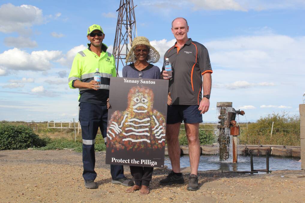 PRECIOUS WATER: Gomeroi elder Polly Cutmore (centre) and ex-NRL players Alfred Duncan and Matty Ryan from Moree, are fighting to stop the Narrabri Gas Project in an effort to protect the Great Artesian Basin. They are pictured at the Glenroy bore at Millie, which is just one of the many natural hot springs in the region.
