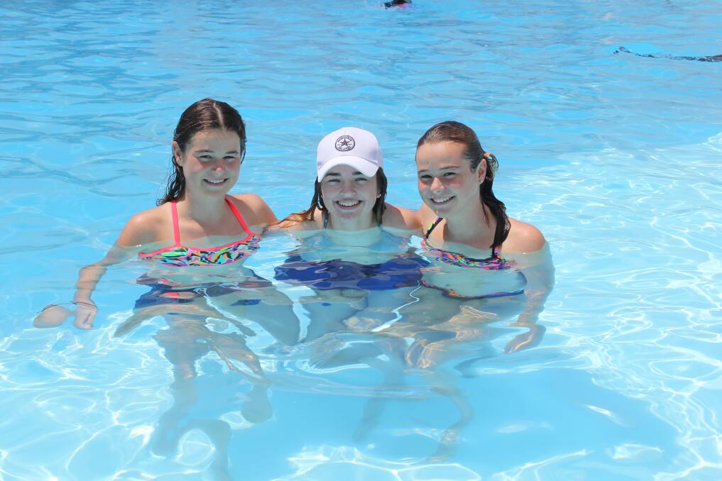 BEATING THE HEAT: Laura Penfold, Ashlyn Tape and Maddy Penfold kept cool in the pool at Moree Artesian Aquatic Centre in January 2018.