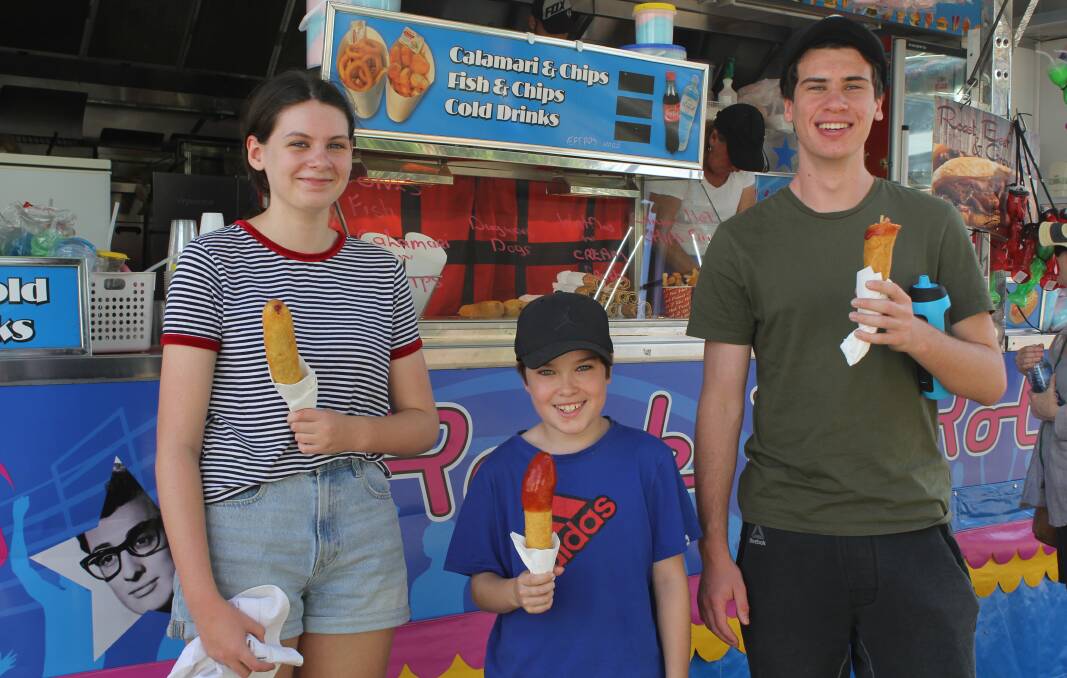 Sylvie Bicknell, Aidan Daly-Hyatt and Clem Bicknell enjoyed a dagwood dog at last year's Moree Show.