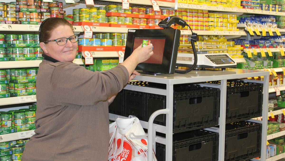CUSTOMER CONVENIENCE: Coles Moree online manager Merri-Ann Storey fills an online Click and Collect order. Photo: Elka Devney