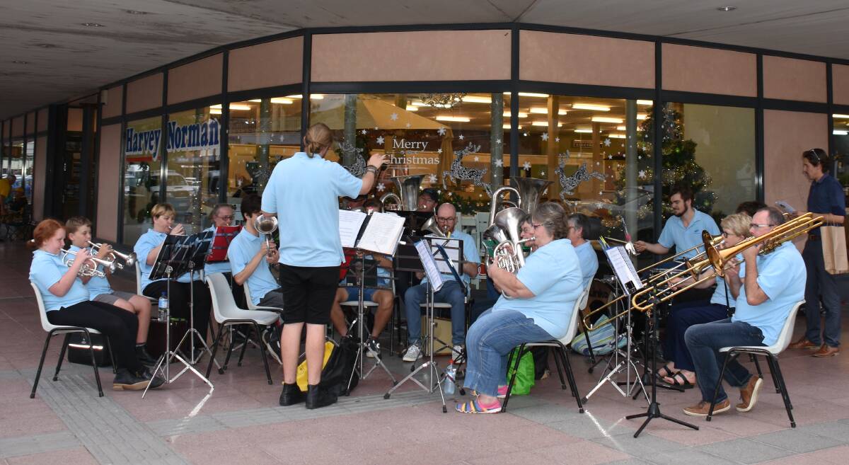 CHRISTMAS SPIRIT: Moree and District Band performed Christmas carols at the twilight Christmas shopping event last week.
