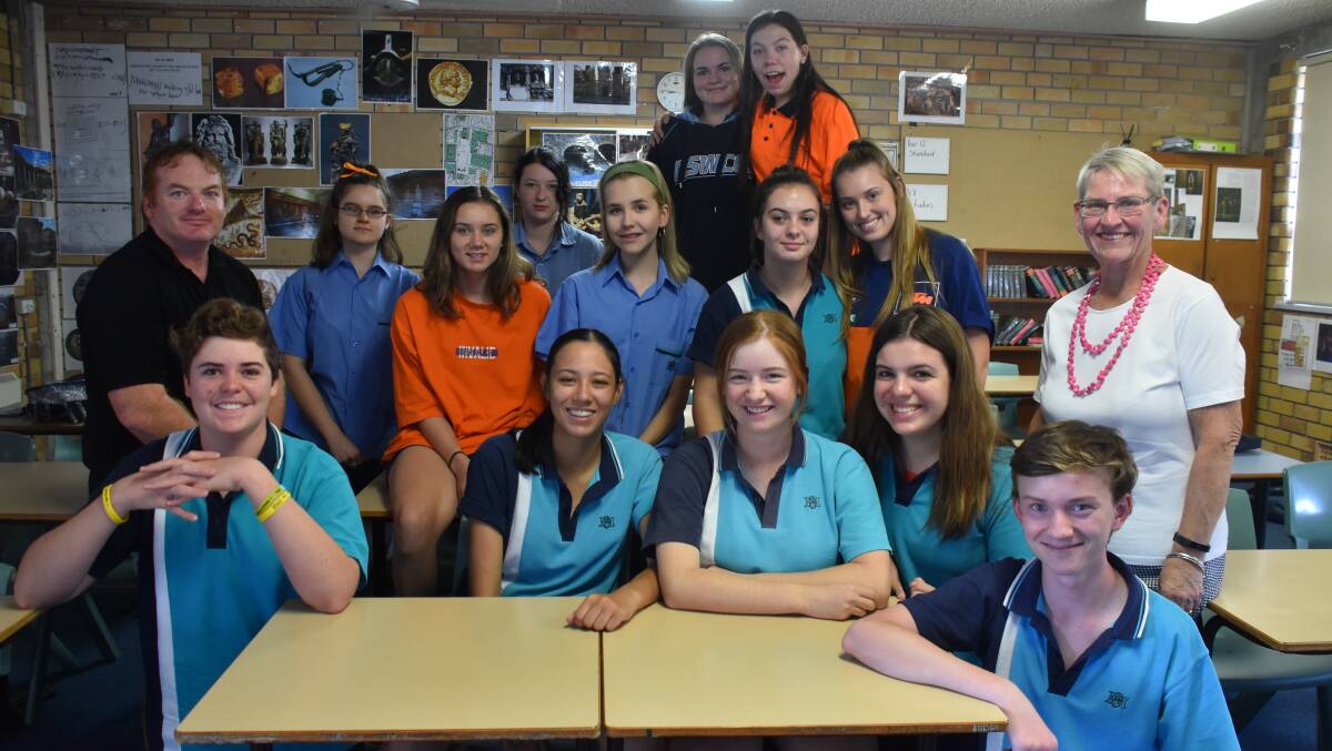 EXCITED: The year 11 ancient history class with teachers Jason Auld (left) and Carol Avenue principal Paula Barton (right), who will be accompanying the students on their excursion to Europe next year.