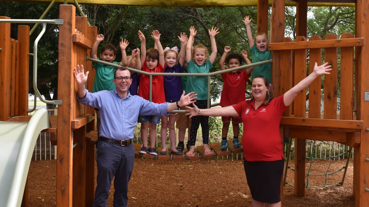 WIN: Northern Tablelands MP Adam Marshall and Grace Lutheran Preschool service leader Megan Fleming celebrate the news of funding from the NSW government to expand the preschool with some of the excited students.