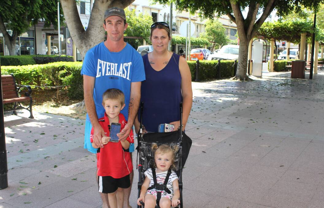 Young Beau Ross shows just how hot it is in Moree on Tuesday. He is pictured with his parents Andrew and Kelly and little sister Amber.