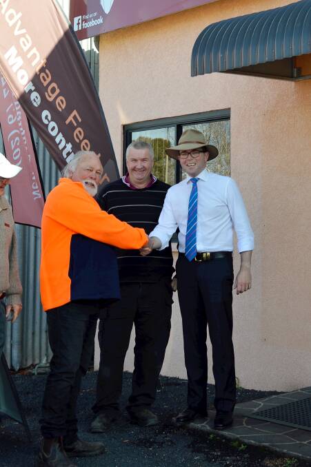 Inverell-based Rangers Hunting and Shooting Club president Geoff Mackay, secretary Warren Kennedy and Northern Tablelands MP Adam Marshall shake hands to celebrate the club’s funding win.