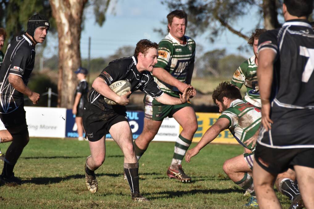 Mitch Adams with the ball when the sides met in Moree earlier in the season.