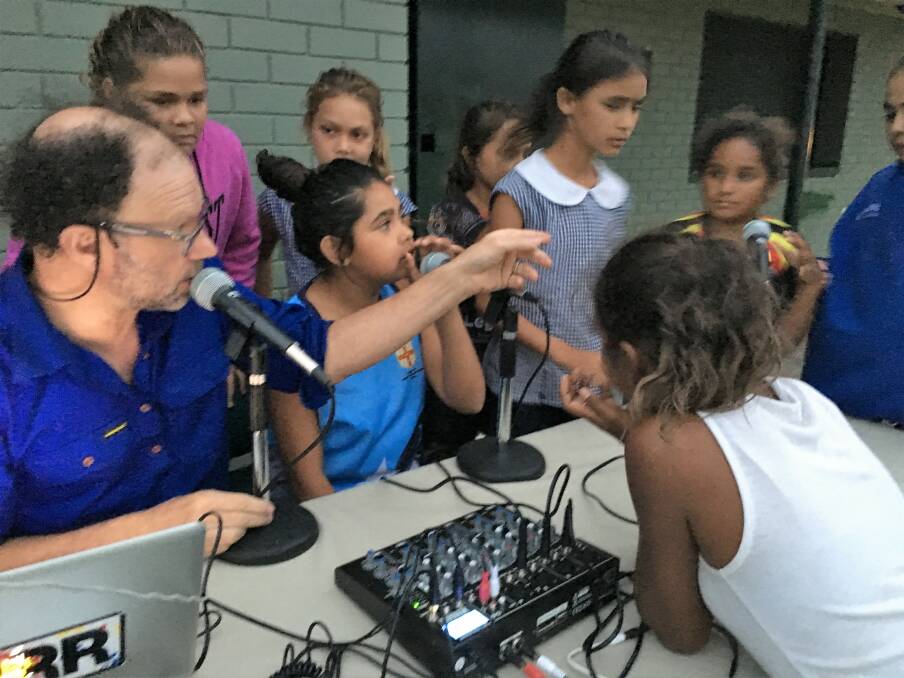 LESSONS IN RADIO: First on the Ladder artistic director Ian Pidd has been teaching local kids how to run a radio station during Moree Boomerangs' home games. 